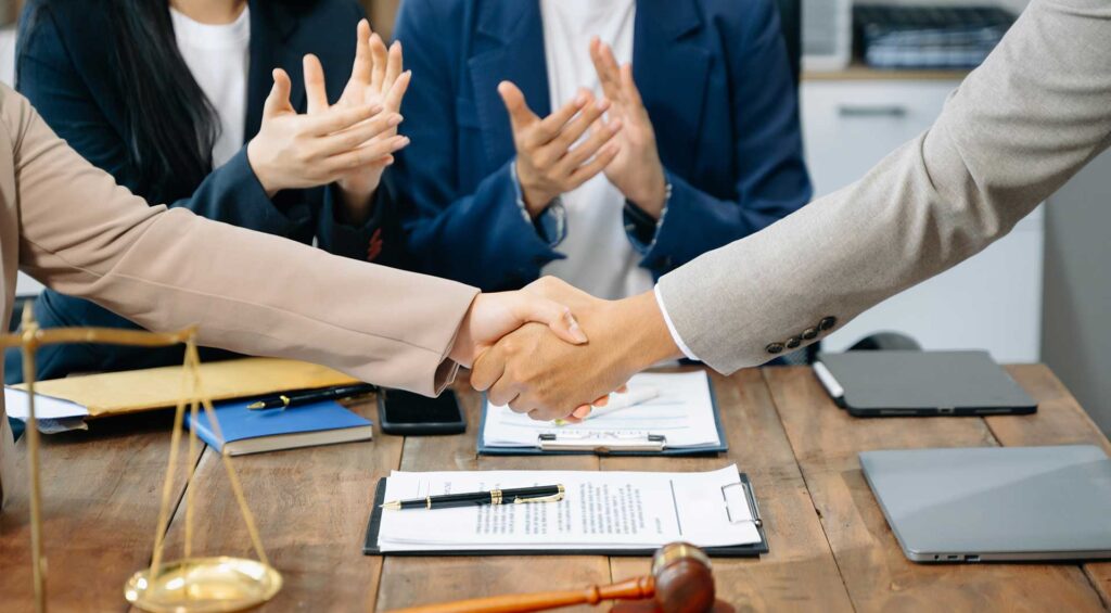 two people shaking hands after Mediation Practice