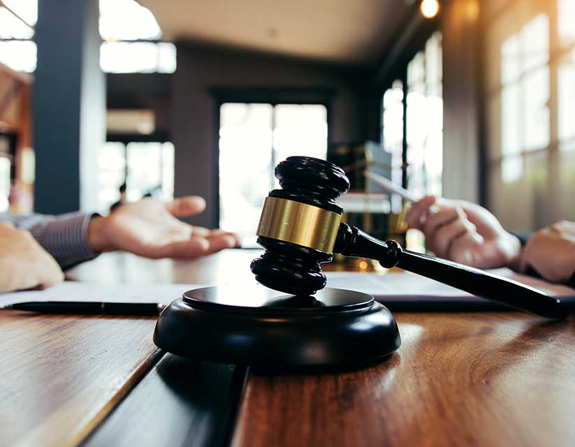 gavel sitting on the table representing complex commercial transactions