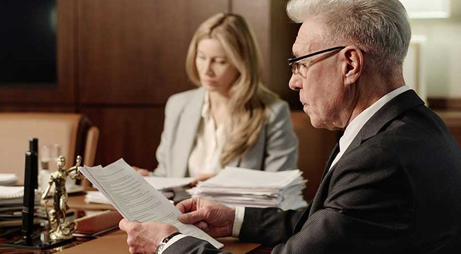 Real Estate attorneys reviewing paperwork
