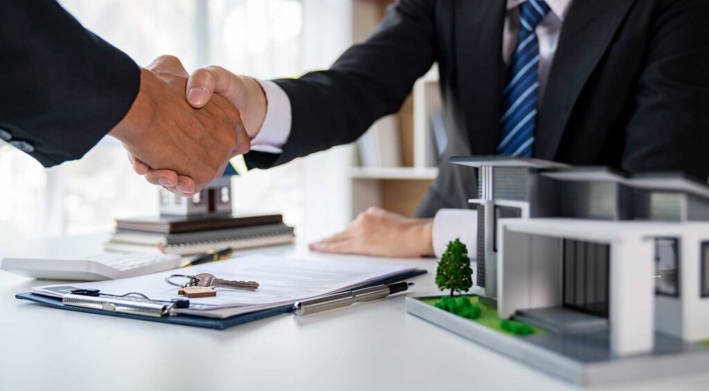 two people shaking hands Real Estate Law